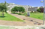 Semantic Pose Verification for Outdoor Visual Localization with Self-supervised Contrastive Learning