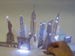 Electronic Popables: Exploring Paper-Based Computing through an Interactive Pop-Up Book
