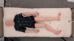 Bodies Uncovered: Learning to Manipulate Real Blankets Around People via Physics Simulations